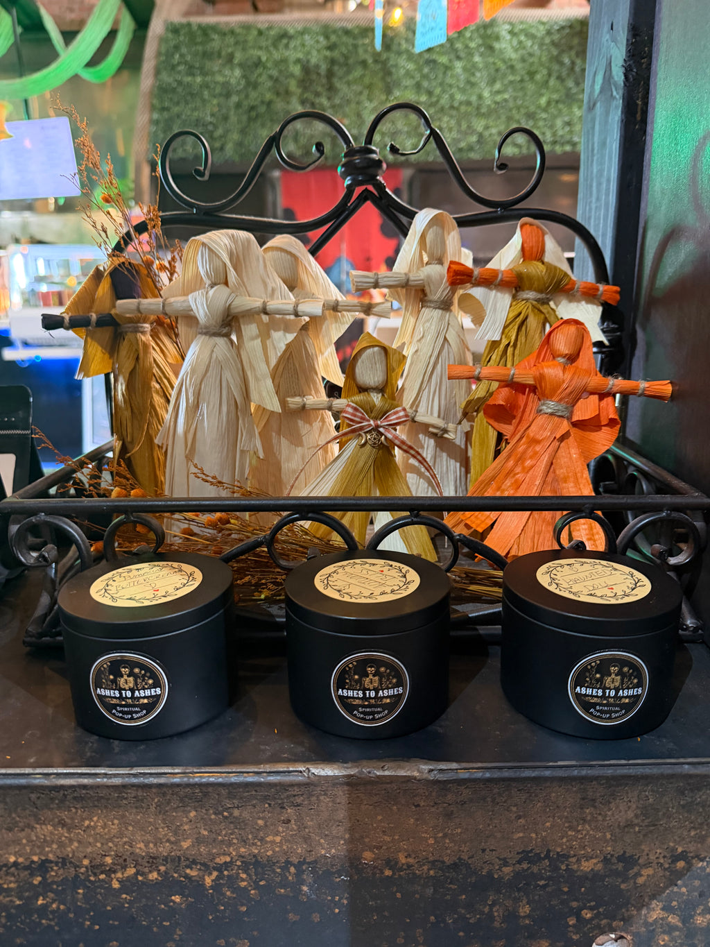 Handmade corn husk dolls and candles by Ashes to Ashes Popup Shop