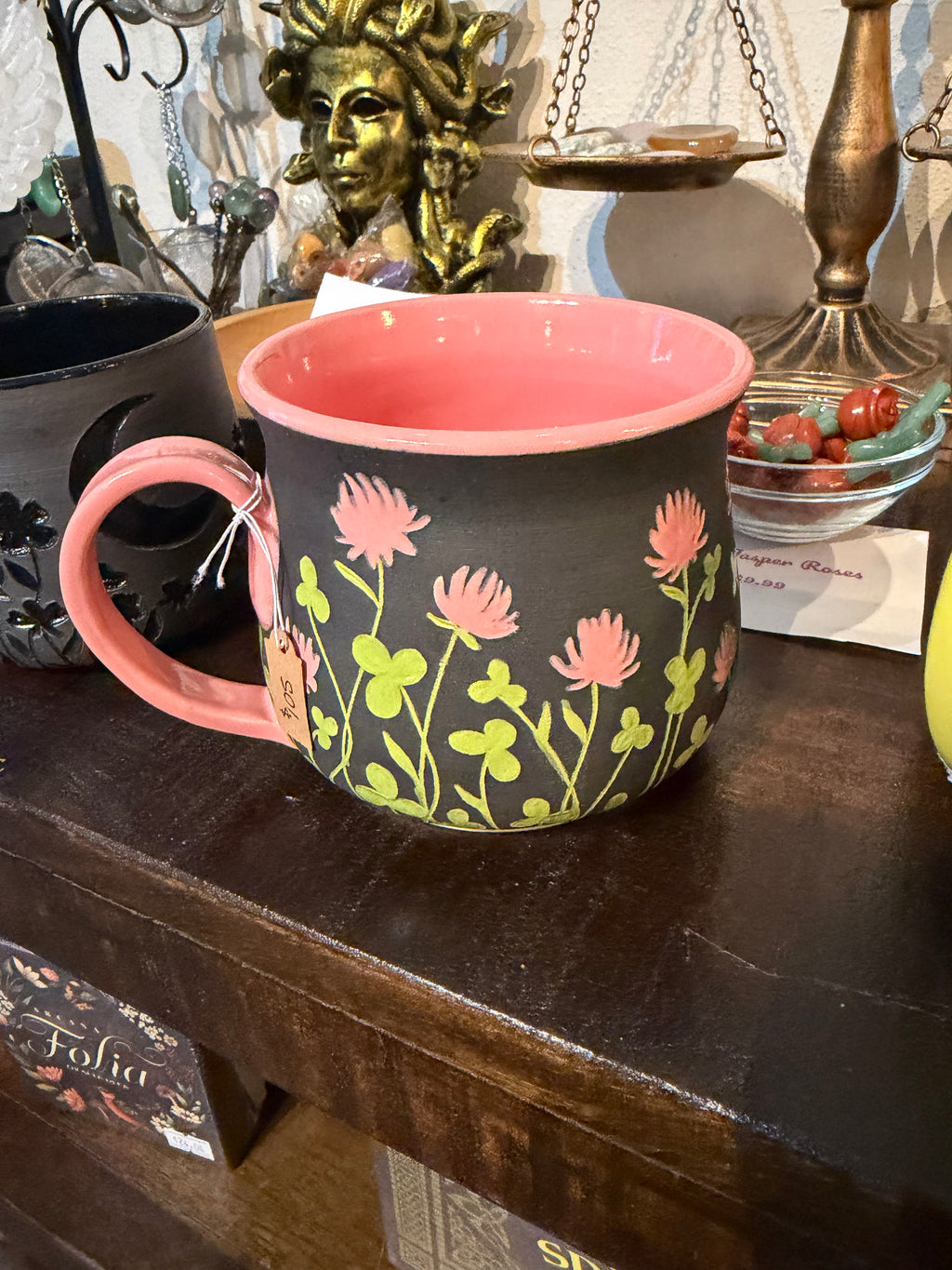 Kelly Gilleran Art black ceramic mug with pink clover flowers