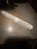 Rough white selenite stick approximately 5.5 inches long